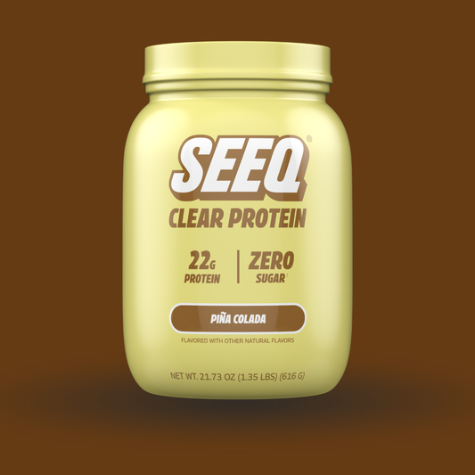 SEEQ Clear Protein container with Pina Colada flavor on a brown background